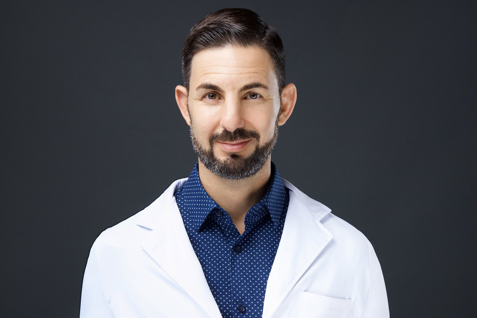 Dr. Jonathan M. Fields, DAOM Dr. Jonathan M. Fields, DAOM, in a white coat
